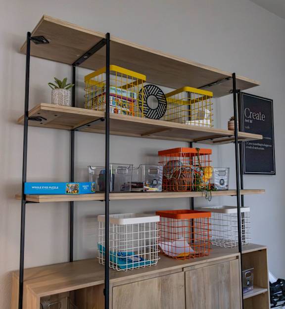 A shelf with a sign that says Create.