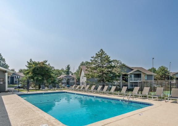 our resort style swimming pool is next to our building and has chairs around it