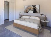 Thumbnail 2 of 18 - a bedroom with a bed and a washing machine in a room