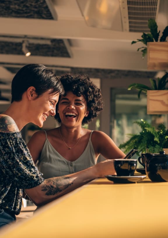 Friends Having Coffee Together Laughing