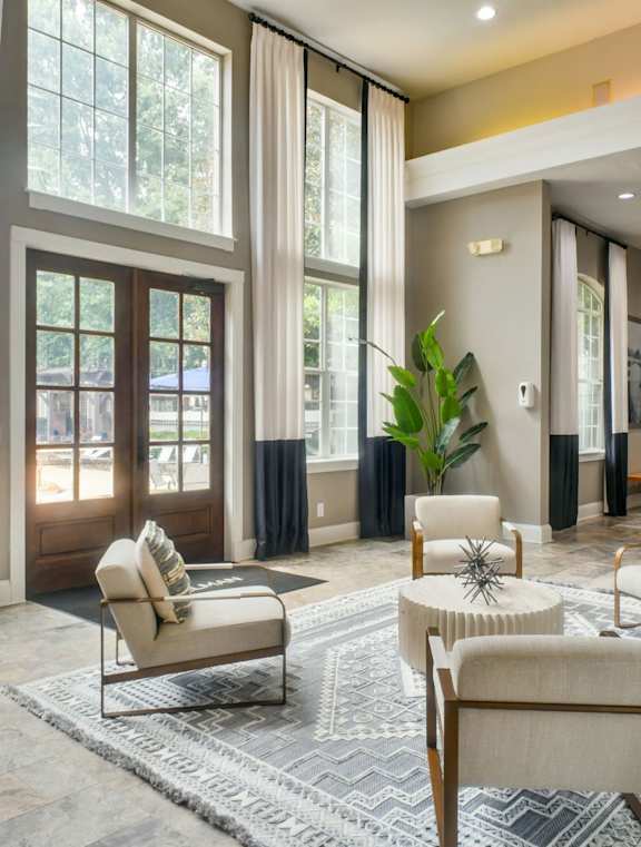 an empty living room with wood floors and white walls at The Ridge at Chenal Valley, Little Rock, Arkansas