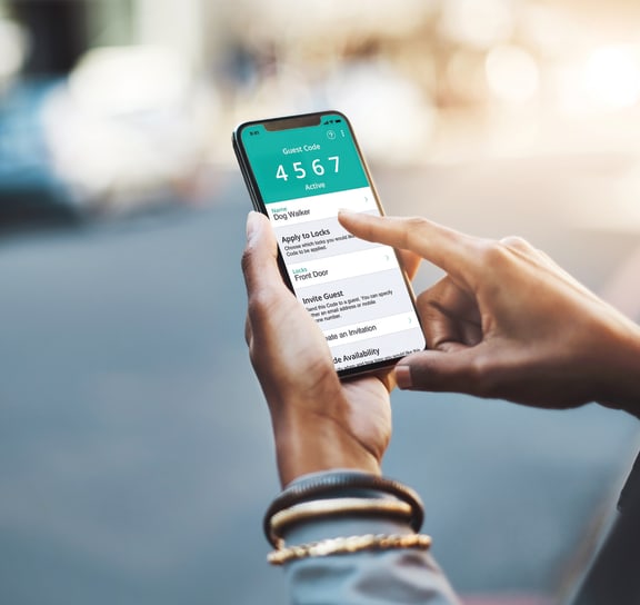 Person Holding a Smartphone with the Uber App on the Screen at Perry Place Apartments, Grand Blanc, Michigan, 48439