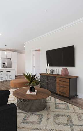 a bedroom with hardwood floors and white walls