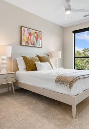 a bedroom with a bed and a chair