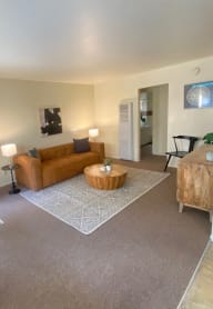 View of the living room from the top of the stairs looking down into the at Bowles Apts, Azusa, CA