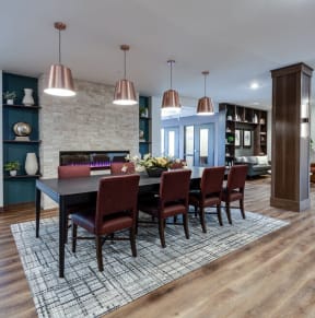 a dining room and living room with a table and chairs