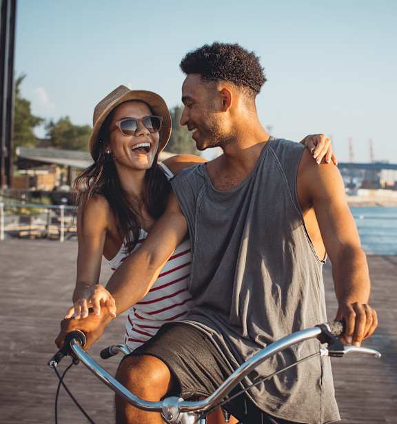 Two people riding a bike
