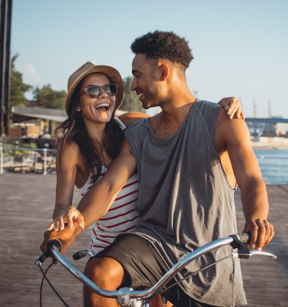 Two people riding a bike