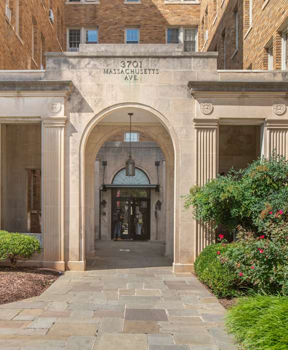 The entrance to a building with a sign that reads "3701 Massachusetts Avenue".