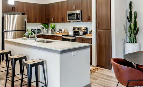 a kitchen and dining area with a table and chairsat Homestead Talking Glass, Prescott Valley, AZ
