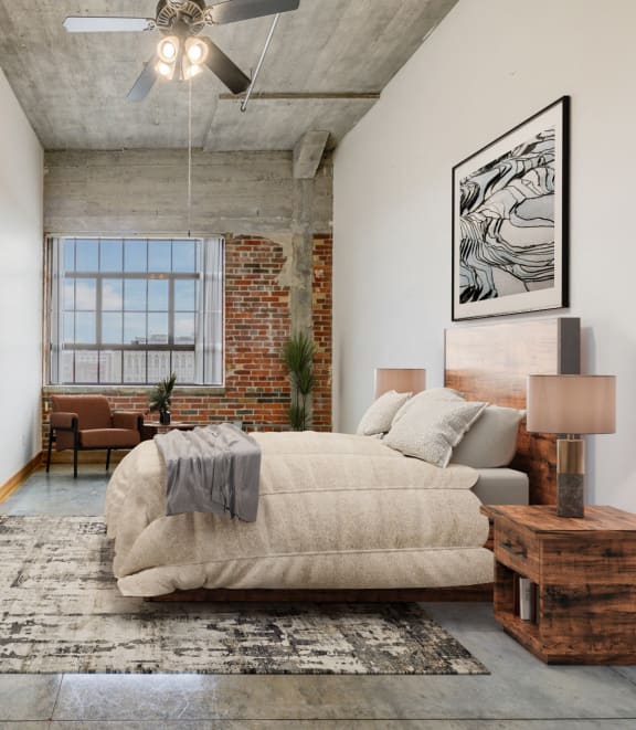 a bedroom with a large bed and a ceiling fan