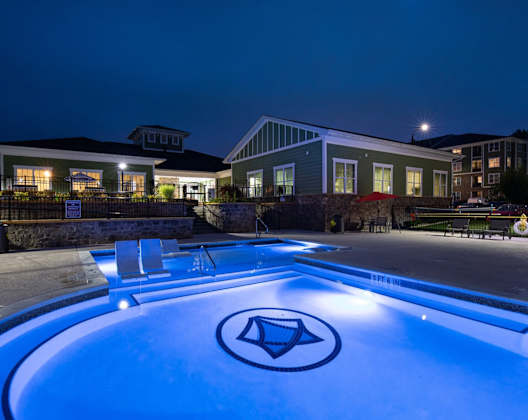 A swimming pool with a diamond logo in the middle of it.