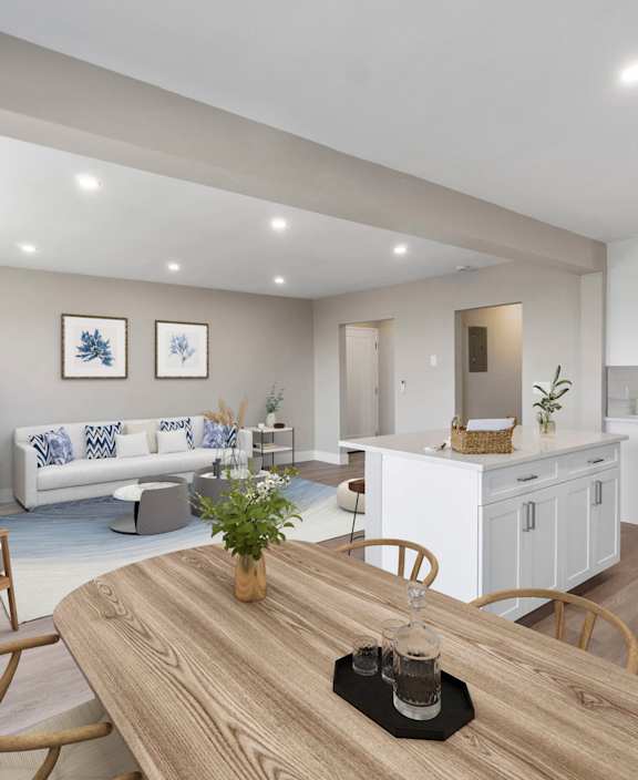 A modern kitchen with a stove top oven and a washing machine built into the cabinetry.at Ocean Edge @ Laguna Beach, California
