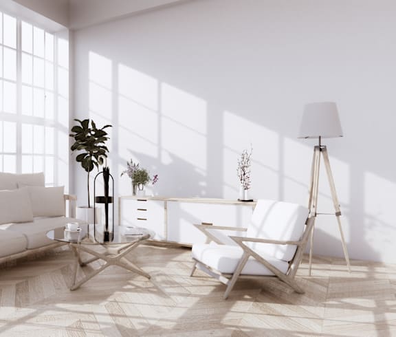 A modern living room with a white sofa, a white chair, and a large window.at The Ridge, Cincinnati, OH 45202