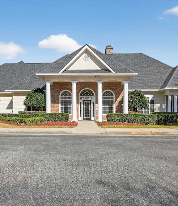 A house with a grey roof and a white front porch at Alexander Ridge Apartments, Canton