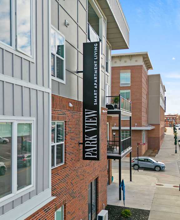 a large brick building with a street in front of it