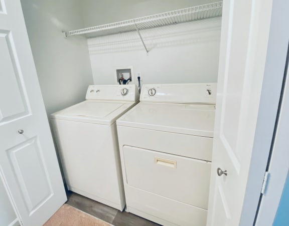the laundry room has a washer and dryer