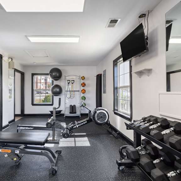 A gym with treadmills and exercise equipment at Village on the Lake Apartments, Apartments, Spring Lake, NC