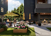 Thumbnail 2 of 7 - Exterior Seating Area at Woodland Place Apartments, Langford, BC, L4H 3P6