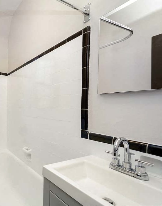 a bathroom with a toilet and a bath tub