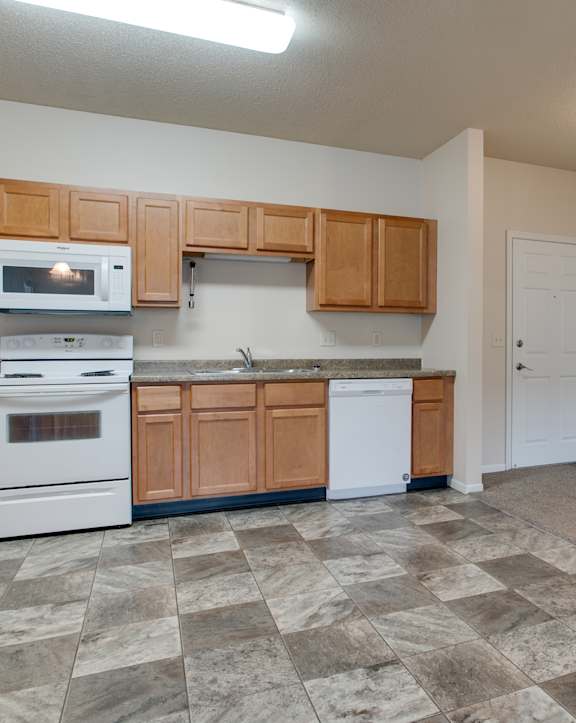 a washer and dryer in the laundry room at Boulder Ridge  Apartments, Fargo, ND