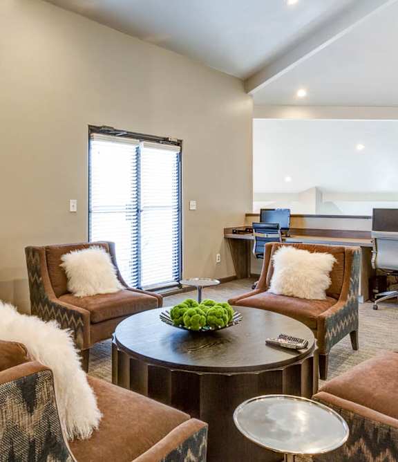 A living room with brown and white furniture.