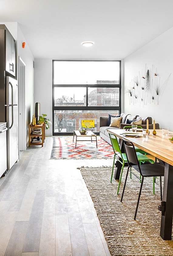 A bedroom with a bed, desk, and chair.