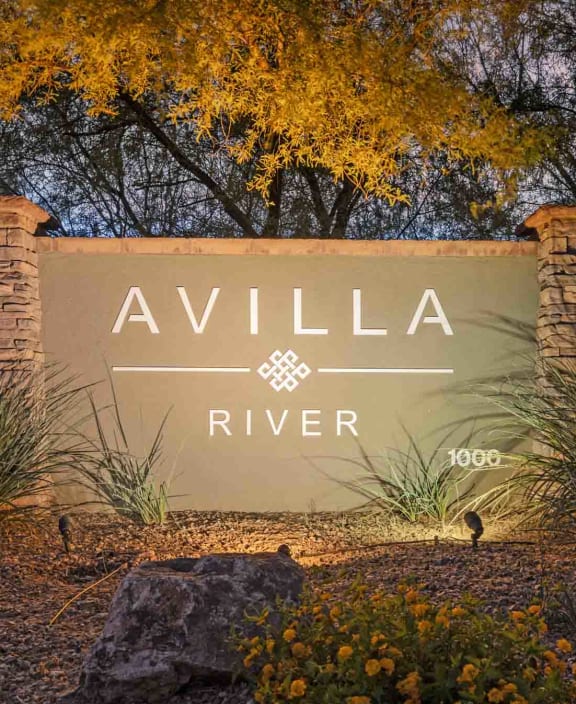 the sign for valley preserve in front of a sunset