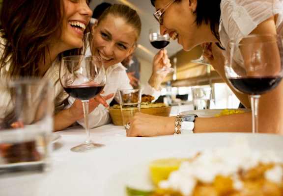 Friends mingling with food and wine