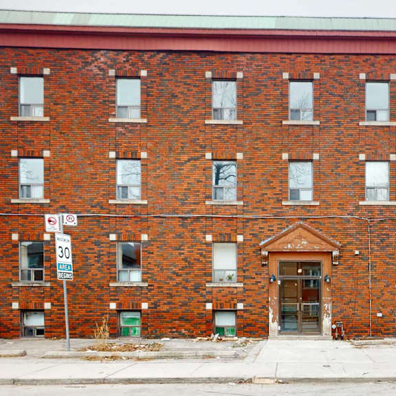 A brick building with a sign that says "Advanced Technologies".
