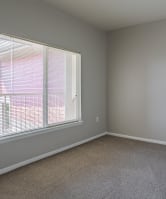 a sofa with white cushions in a living room at Stetson Meadows Apartments, Colorado Springs, CO, 80922