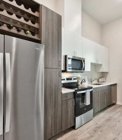 Stainless Steel Appliances, Two-Tone Cabinets in Kitchen with Subway Tile Backsplash in Austin, Texas