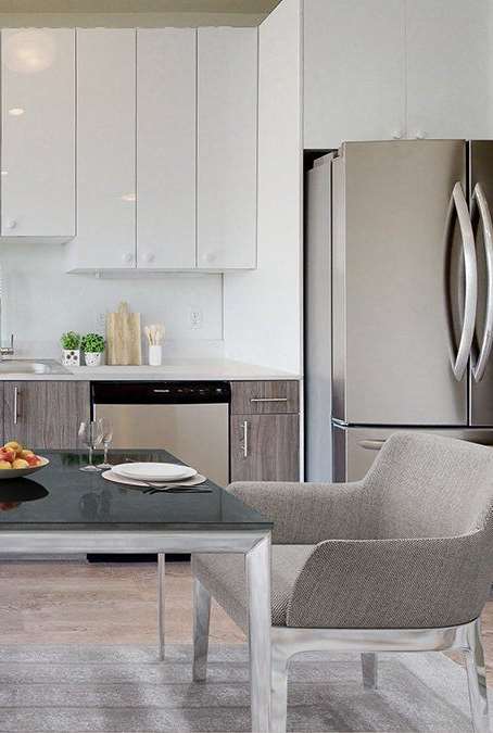 A modern living room with a large sectional sofa and a view of the outdoors.