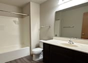 Thumbnail 16 of 34 - A modern bathroom with a walk-in shower and a wooden ceiling.