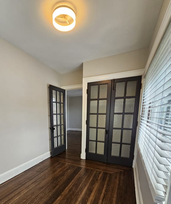 a view of a hallway with a wood accent wall and a ceiling light at Cincinnati Premier Living*, Ohio