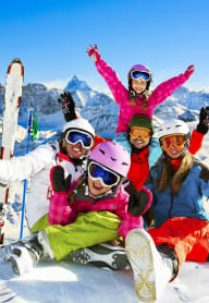 Group of Friends Smiling Having Fun Skiing Together