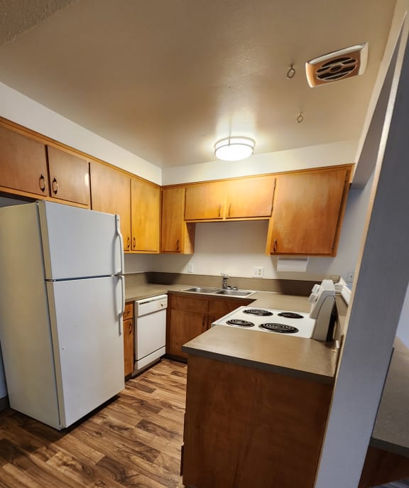 an overhead view of the kitchen and stairs to the loft