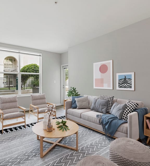 a living room with gray walls and a gray couch