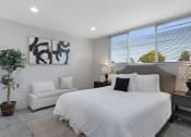 Thumbnail 14 of 17 - a bedroom with a large bed next to a window