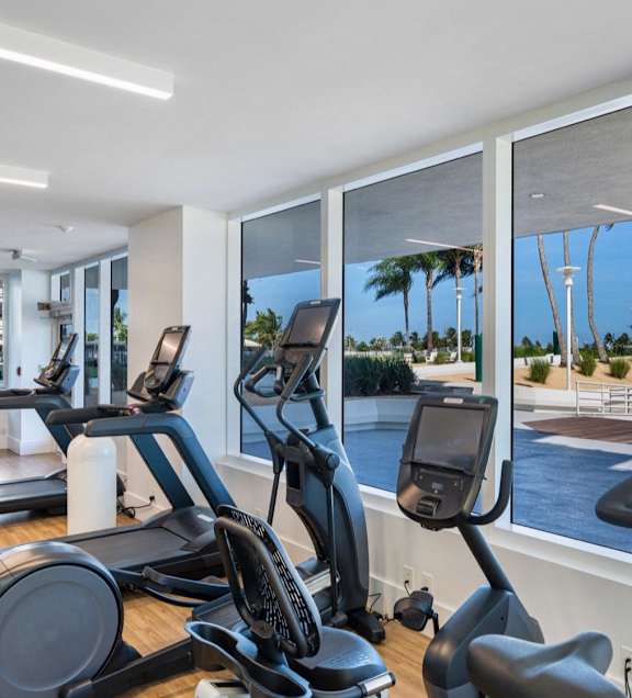A gym with treadmills and elliptical machines. at The Hamilton, Miami, 33137