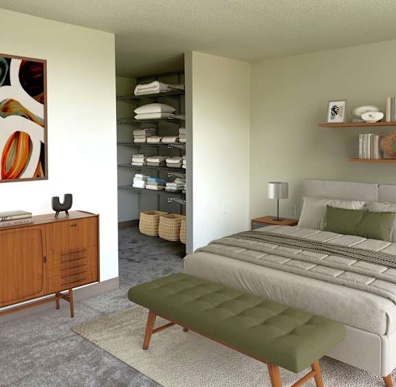 A bedroom with a large bed and a wooden cabinet.