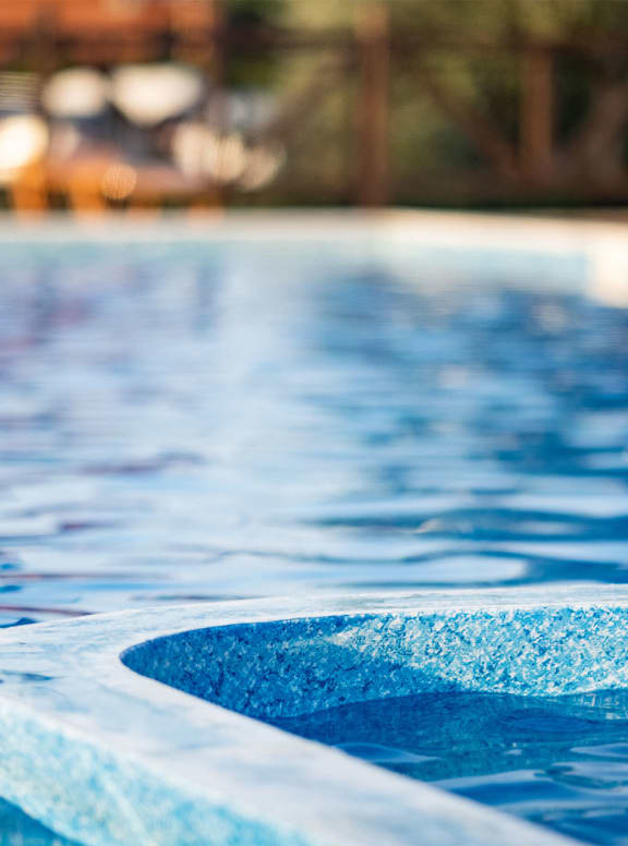 a swimming pool with blue water