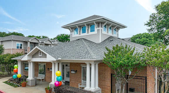 a home with balloons in the front yard