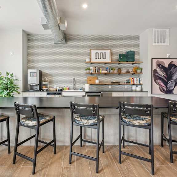 the kitchen is open to the living room and dining room at The Quarry Luxury Apartment Homes, Fort Collins, CO, 80526