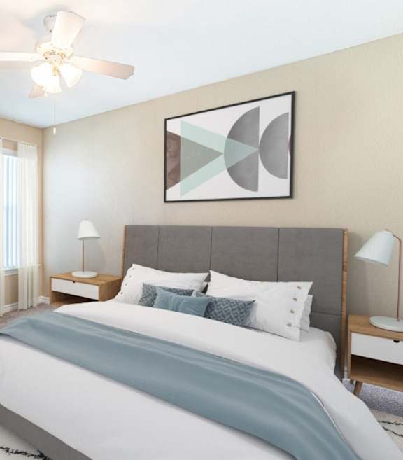 Two twin beds with blue and beige comforters in a room with white walls.