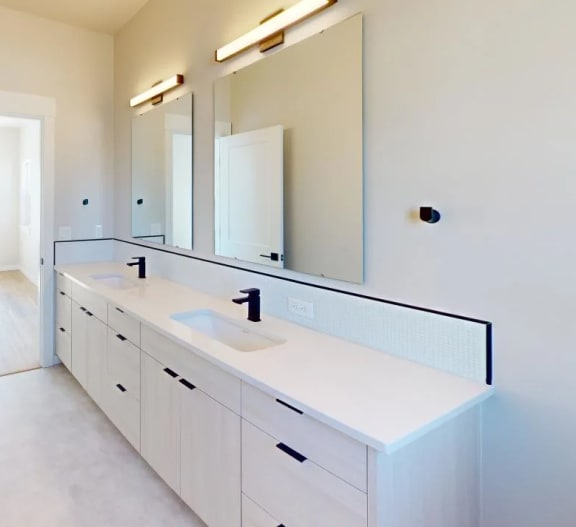a bathroom with a sink and a mirror&#xA0;at Alpine Landing Townhomes, Garden City, 83714