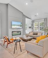 room with a shuffle board table with chairs at spire luxury apartments in charlotte nc