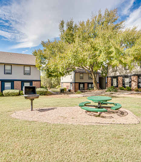 a kitchen with a stove and a sink  at Arbors Of Cleburne, Cleburne, 76033