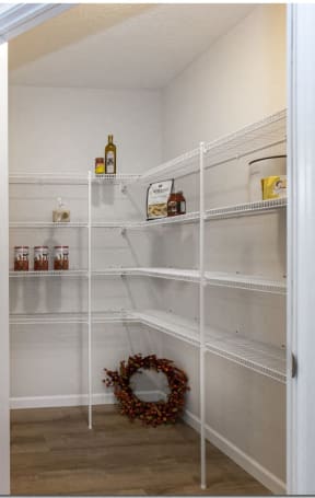 a kitchen with a island and a stainless steel refrigerator