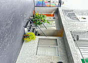Thumbnail 16 of 19 - a view of a courtyard with stairs and an orange door at The Marq Apartments LLC, Los Angeles